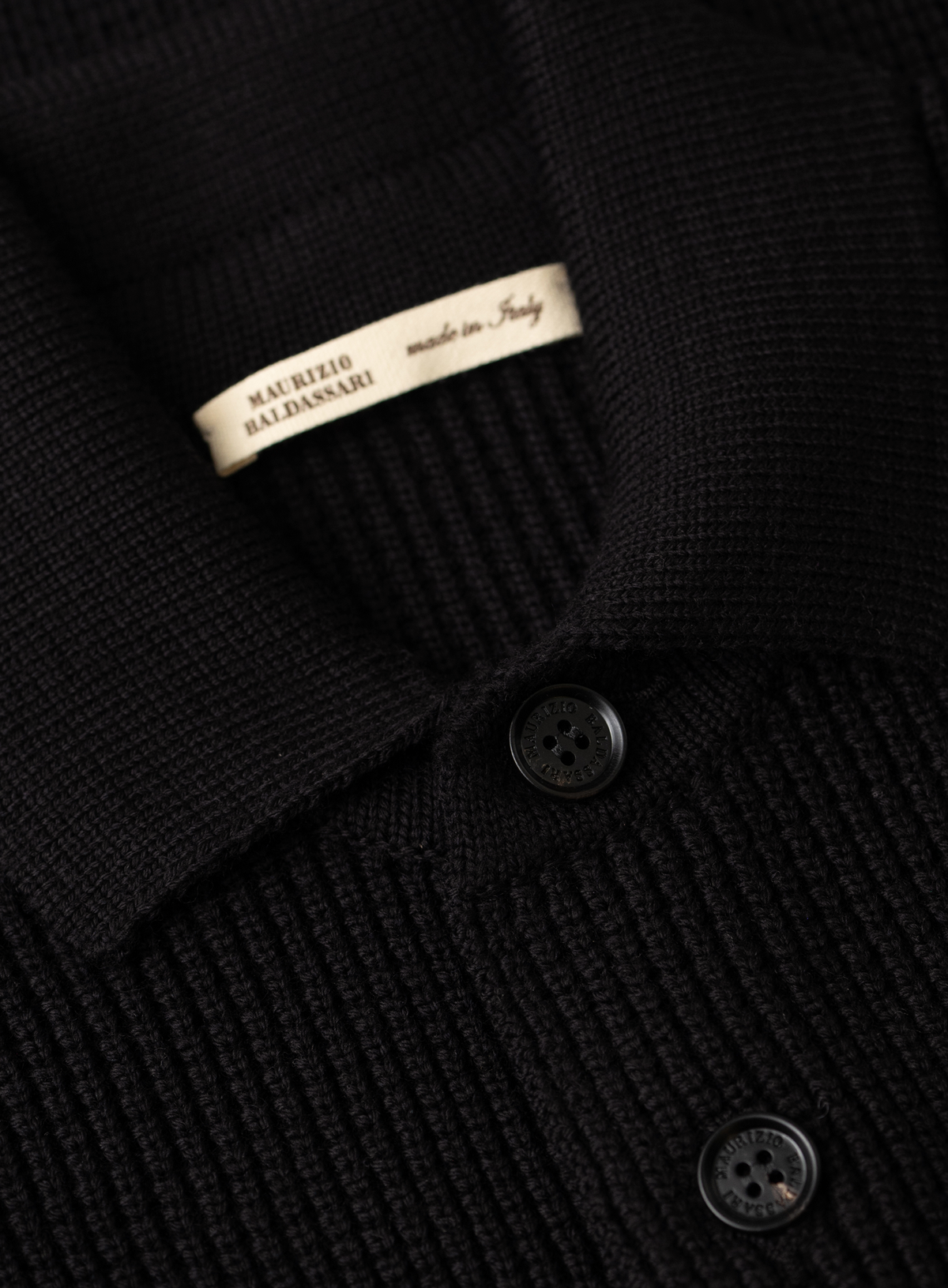 Knoopvest in wol | FULL_WIDTH | Zwart